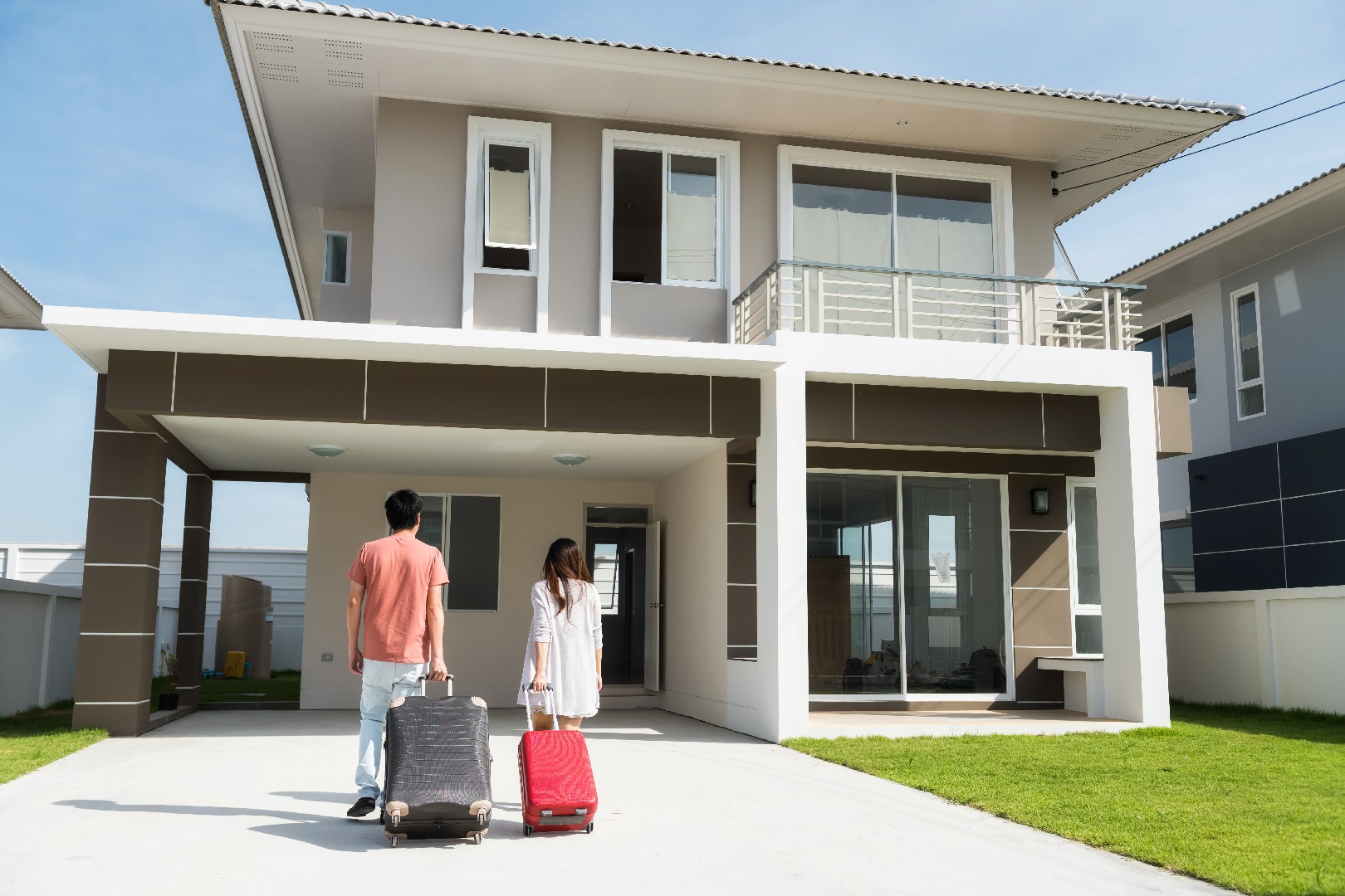 Asian couple move to new house