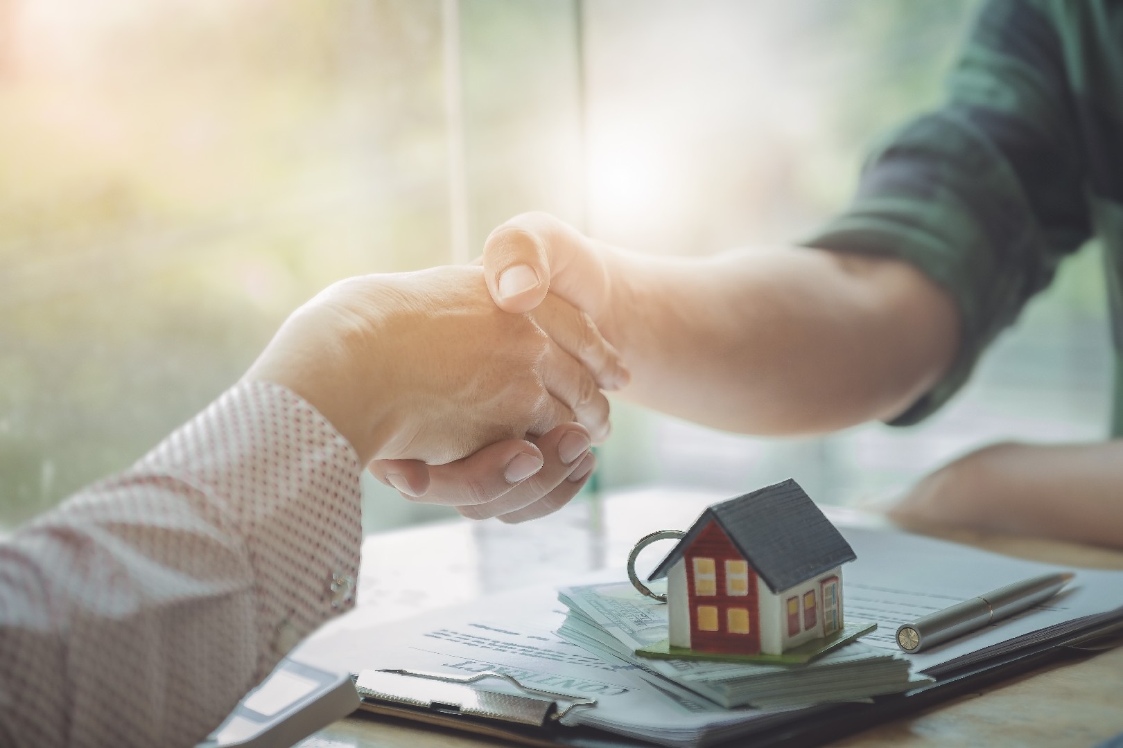 Real estate agents agree to buy a home and give keys to clients